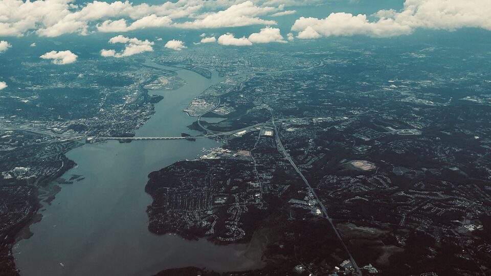 Aerial view of a city representing housing research
