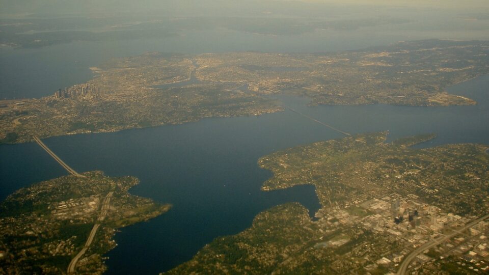 Urban landscape representing climate-driven displacement and housing precarity